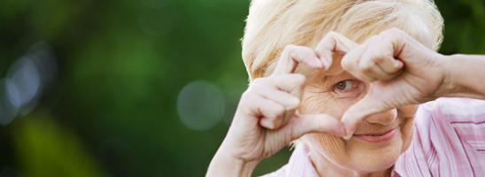 Positivity. Happy Funny Senior Woman Showing Symbol of Heart