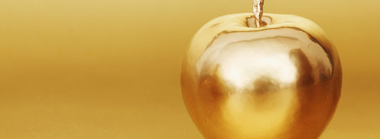 gold apple on gold background